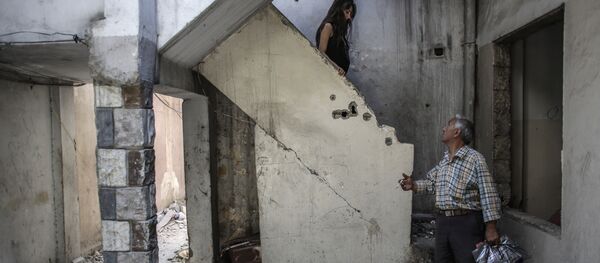 Cristianos sirios en su casa en Homs Cristianos sirios en su casa en Homs - Sputnik Mundo