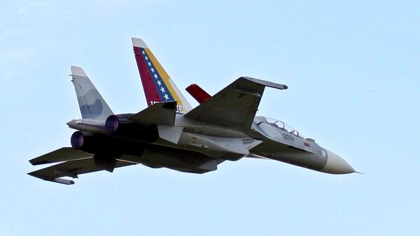 Venezuela's two Sukhoi fighter jets fly during the anniversary celebration of Venezuela's Air Force in Maracay, Venezuela, Sunday, Dec. 10, 2006. - Sputnik Mundo