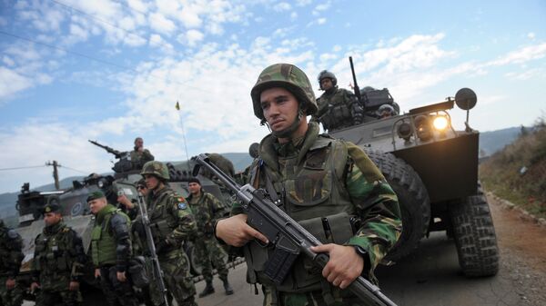 Portuguese NATO-led peacekeepers (KFOR) stand guard at the entrance of the village of Zupce, in Serb-majority northern Kosovo - Sputnik Mundo