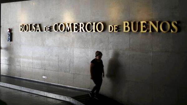 A woman walks at the Buenos Aires stock exchange building, Argentina - Sputnik Mundo