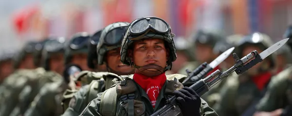 Soldiers march during a military parade commemorating the one year anniversary of the death of Venezuela's former President Hugo Chavez in Caracas, Venezuela Soldiers march during a military parade commemorating the one year anniversary of the death of Venezuela's former President Hugo Chavez in Caracas, Venezuela - Sputnik Mundo
