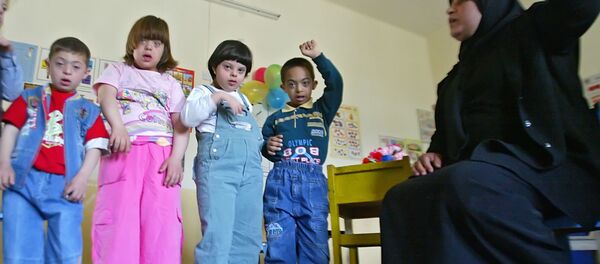 Niños iraquíes con síndrome de Down - Sputnik Mundo