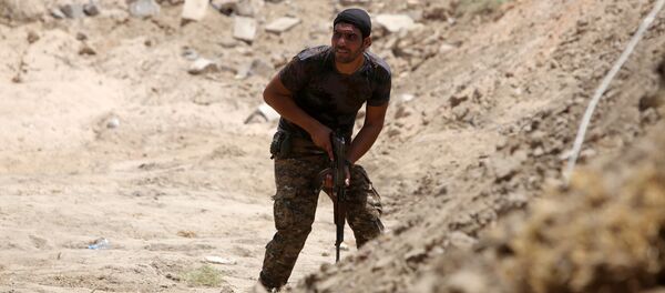 Miembro de las Fuerzas de la Movilización Popular en Irak (archivo) - Sputnik Mundo