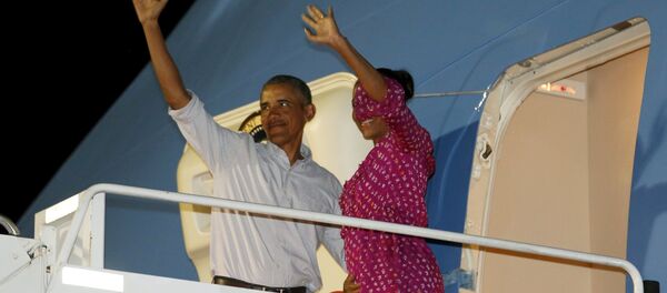 Barack Obama, presidente de EEUU, con la primera dama Michelle Obama - Sputnik Mundo