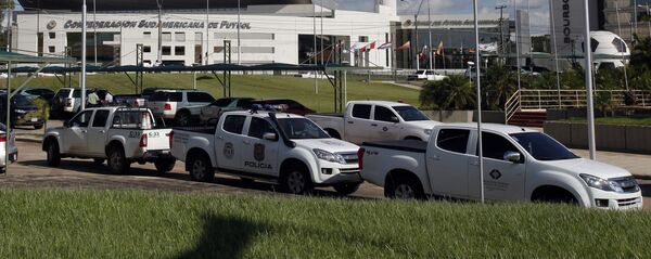 Police vehicles are parked outside the headquarters of the South American soccer confederation known as CONMEBOL in Asuncion, Paraguay, Thursday, Jan. 7, 2016 - Sputnik Mundo