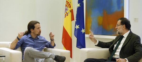 El secretario general de Podemos, Pablo Iglesias, y el presidente del Gobierno, Mariano Rajoy - Sputnik Mundo