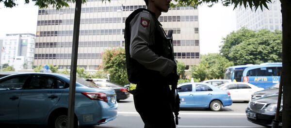 Un policía indonesio - Sputnik Mundo