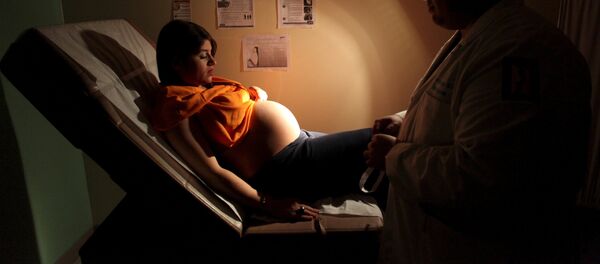 Una mujer embarazada en San Juan, Puerto Rico - Sputnik Mundo