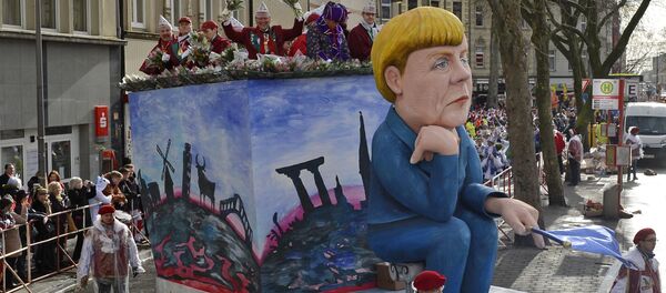 Figura de Angela Merkel durante el Carnaval de Colonia - Sputnik Mundo