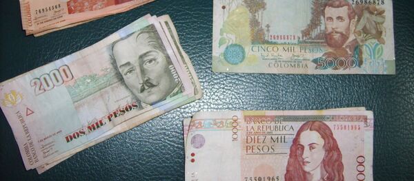 Pesos colombianos - Sputnik Mundo