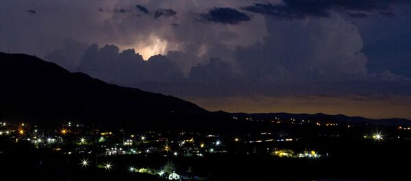 In this Feb. 12, 2016 photo, lightening strikes near the town of Capilla del Monte, Cordoba, Argentina - Sputnik Mundo