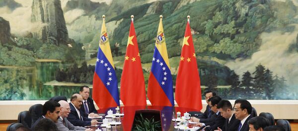 El presidente venezolano Nicolás Maduro se reune con el primer ministro chino Li Keqiang El presidente venezolano Nicolás Maduro se reune con el primer ministro chino Li Keqiang - Sputnik Mundo