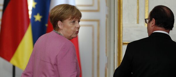 Canciller de Alemania, Angela Merkel y presidente de Francia, François Hollande - Sputnik Mundo