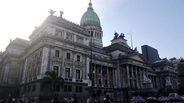 A man rides his motorcycle past the Argentine Congress in Buenos Aires, Argentina - Sputnik Mundo