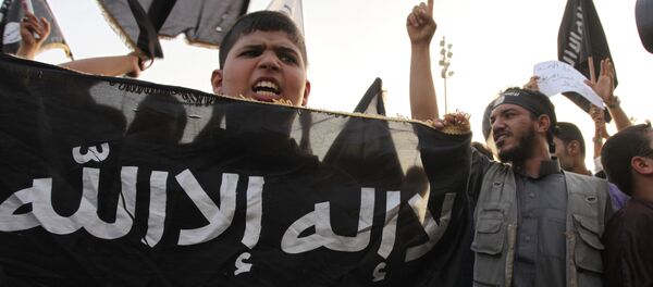 Seguidores de Daesh (archivo) - Sputnik Mundo