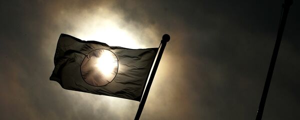 The Japanese flag flies over the island during the 60th anniversary of the Battle of Iwo JIma on Iwo Jima, Japan on Saturday March 12, 2005 - Sputnik Mundo