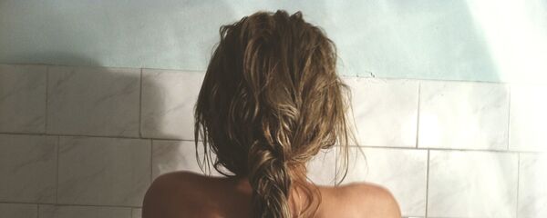 Una mujer - Sputnik Mundo