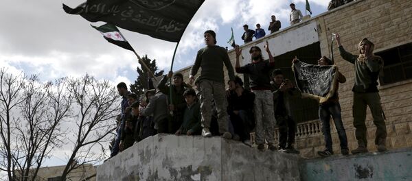 Militantes con banderas extremistas, Idlib, Siria (archivo) Militantes con banderas extremistas, Idlib, Siria (archivo) - Sputnik Mundo