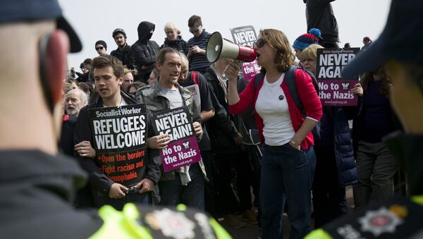 Manifestacón en apoyo de los migrantes - Sputnik Mundo