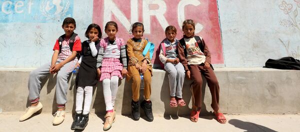 Los niños yazidíes de Sinjar en un campo de refugiados en Irak - Sputnik Mundo