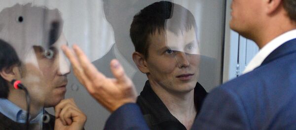 Ciudadanos rusos, Evgueni Eroféev y Alexandr Alexándrov, durante el proceso penal Ciudadanos rusos, Evgueni Eroféev y Alexandr Alexándrov, durante el proceso penal - Sputnik Mundo