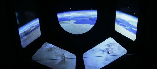 A reproduction of the view of the earth from a spaceship is displayed at the museum of the science and technologies in Milan, Italy, Friday, Feb. 12, 2016 - Sputnik Mundo