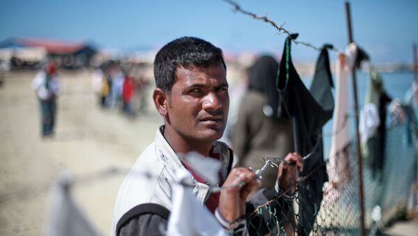 Refugiado libio - Sputnik Mundo