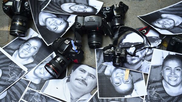 View of photos of killed journalists and cameras outside the Veracruz state representation office during a journalists protest in Mexico City on February 11, 2016. - Sputnik Mundo