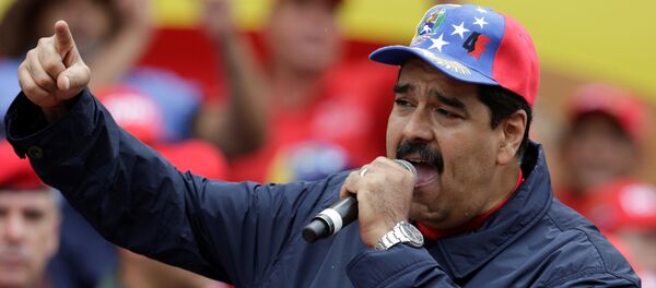 Venezuela's President Nicolas Maduro gestures as he talks to supporters during a rally to commemorate May Day, in Caracas, Venezuela, May 1, 2016. - Sputnik Mundo