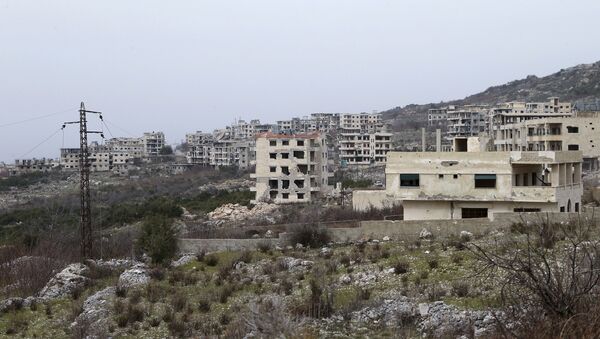 This photo taken on Friday, Jan. 22, 2016, shows destroyed buildings in Salma, Syria - Sputnik Mundo