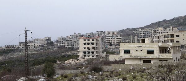 This photo taken on Friday, Jan. 22, 2016, shows destroyed buildings in Salma, Syria - Sputnik Mundo