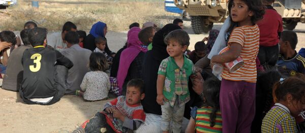 Беженцы с территории ИГ в районе города Киркук в Ираке - Sputnik Mundo