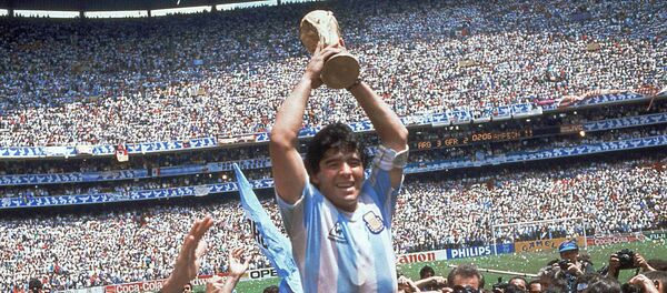 Diego Maradona of Argentina celebrates with the cup at the end of the World Cup soccer final in the Atzeca Stadium, in Mexico City, Mexico - Sputnik Mundo