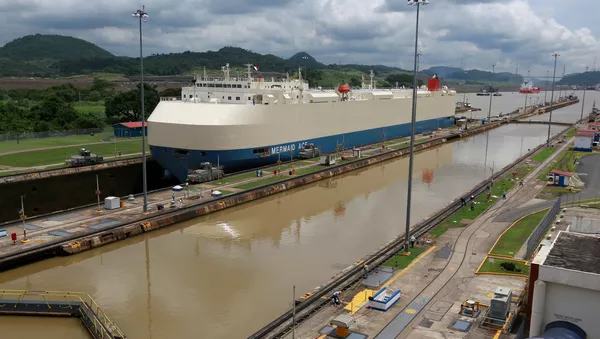 A cargo ship is pictured crossing through the Miraflores locks, a day before the inauguration of the Panama Canal Expansion project, in Panama City, Panama June 25, 2016
