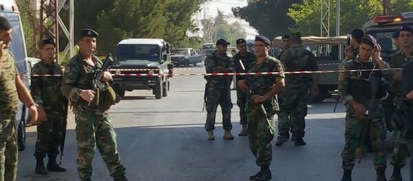 Soldados libaneses cerca del lugar de los atentados suicidas Soldados libaneses cerca del lugar de los atentados suicidas - Sputnik Mundo