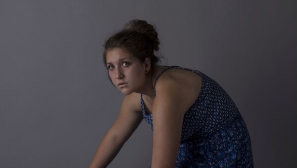 Una mujer - Sputnik Mundo