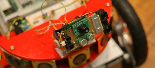 Un robot con cámara Un robot con cámara - Sputnik Mundo