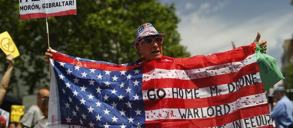 Protestas contra la presencia de Barack obama, presidente estadounidense, en Madrid, España - Sputnik Mundo