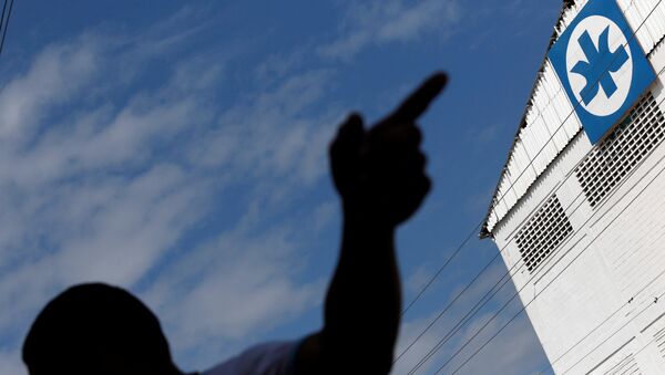 El logo de  Kimberly-Clark en Maracay - Sputnik Mundo