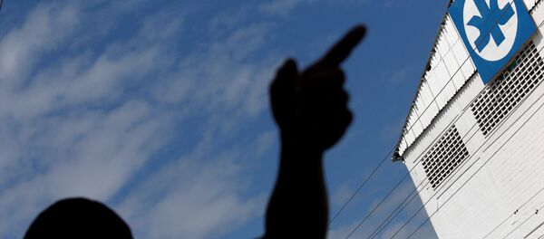 El logo de  Kimberly-Clark en Maracay - Sputnik Mundo