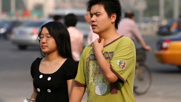 Una pareja china - Sputnik Mundo