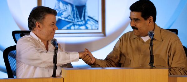 Presidente de Colombia, Juan Manuel Santos, y presidente de Venezuela, Nicolás Maduro - Sputnik Mundo