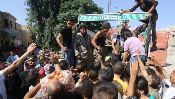 La ayuda humanitaria para los residentes de Alepo - Sputnik Mundo