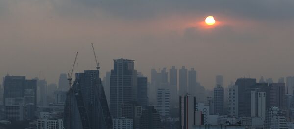 A partial solar eclipse is seen in Bangkok, Thailand, March 9, 2016. A partial solar eclipse is seen in Bangkok, Thailand, March 9, 2016. - Sputnik Mundo