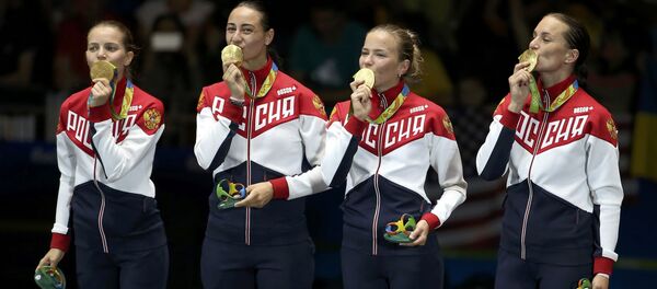 Deportistas rusas con medallas de oro - Sputnik Mundo