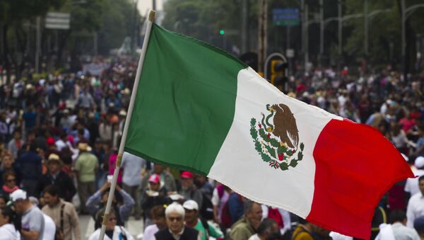 Supporters of Mexican leader of the National Regeneration Movement, Andres Manuel Lopez Obrador, protest in support of the National Coordination of Education Workers (CNTE) teachers' union, and against an education reform launched by the government along Reforma Avenue in Mexico City on June 26, 2016. - Sputnik Mundo