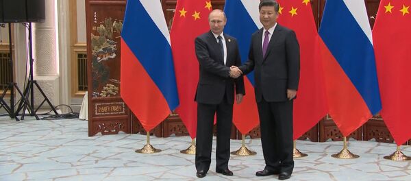 Vladímir Putin, presidente de Rusia, y Xi Jinping, presidente de China - Sputnik Mundo