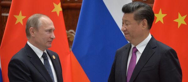El presidente de Rusia, Vladímir Putin, y el presidente de China, Xi Jinping - Sputnik Mundo
