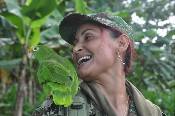Patricia. Comandante de escuadra. Ha combatido por 20 años junto a su esposo. Su hijo de once años vive en Medellín Patricia. Comandante de escuadra. Ha combatido por 20 años junto a su esposo. Su hijo de once años vive en Medellín - Sputnik Mundo