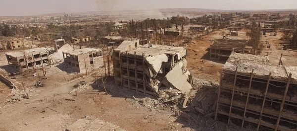 El edificio destrozado de la Escuela Aérea de Siria en Alepo El edificio destrozado de la Escuela Aérea de Siria en Alepo - Sputnik Mundo